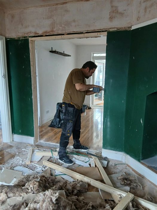 Fitting the lining of a newly widened doorway between two rooms